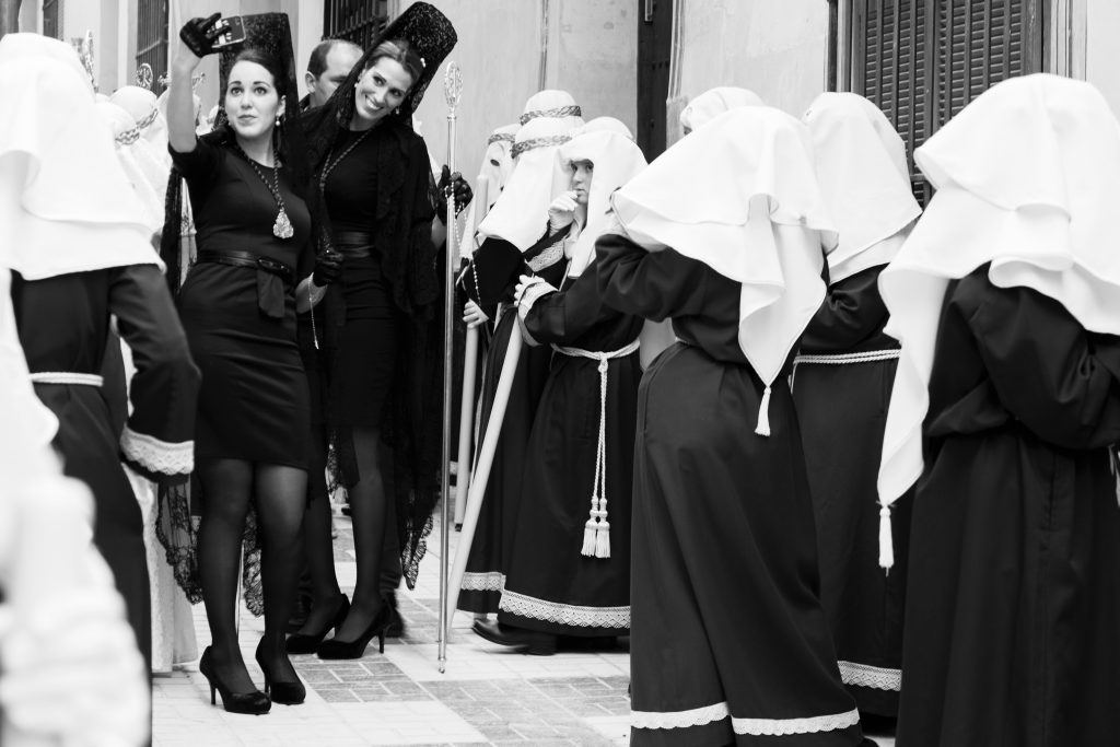 Women wearing the typical mantilla during Easter in Spain.